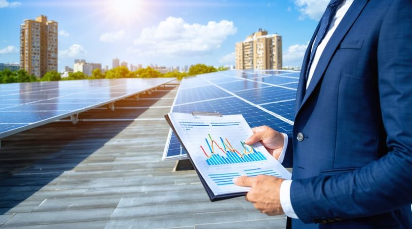 A modern commercial building with a rooftop solar panel installation and a business professional holding a financial report, showcasing the financial benefits and sustainability of solar energy.