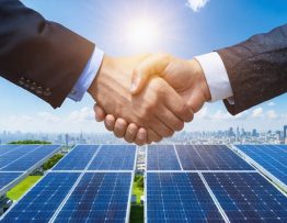 A futuristic cityscape powered by public-private solar partnerships, with officials and business leaders shaking hands under a vibrant sky filled with solar panels, symbolizing collaboration and innovation in clean energy.