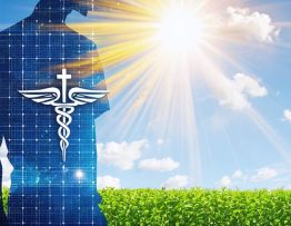 Conceptual depiction of solar energy transforming into healthcare symbols over a modern hospital, representing the integration of solar power in medical facilities.